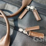 Stitched leather zipper pulls